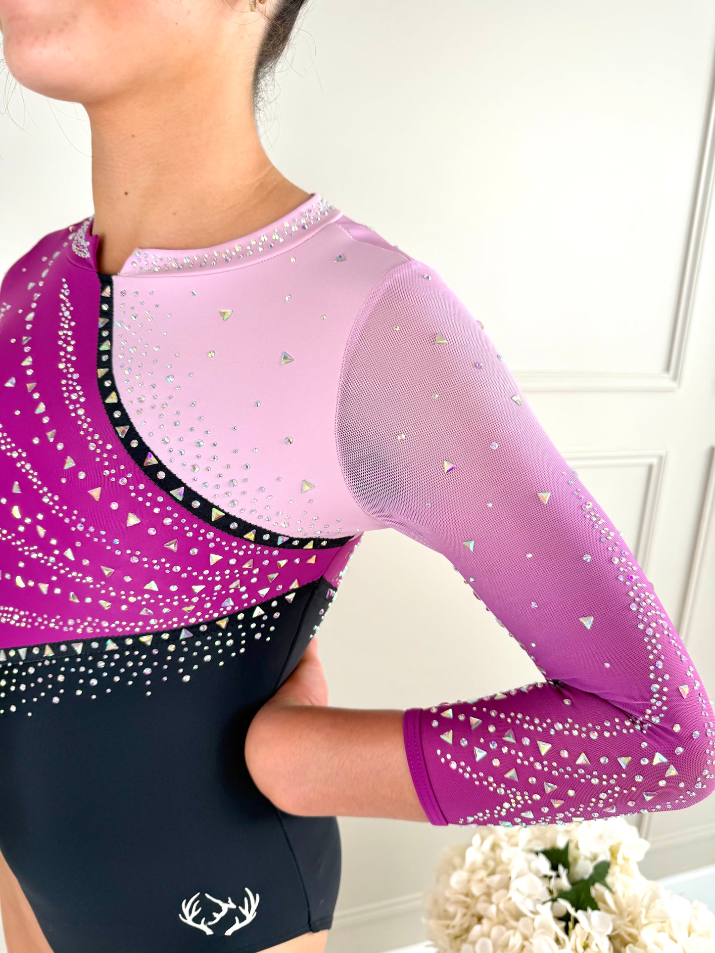 Pink gymnastics competition leotard.