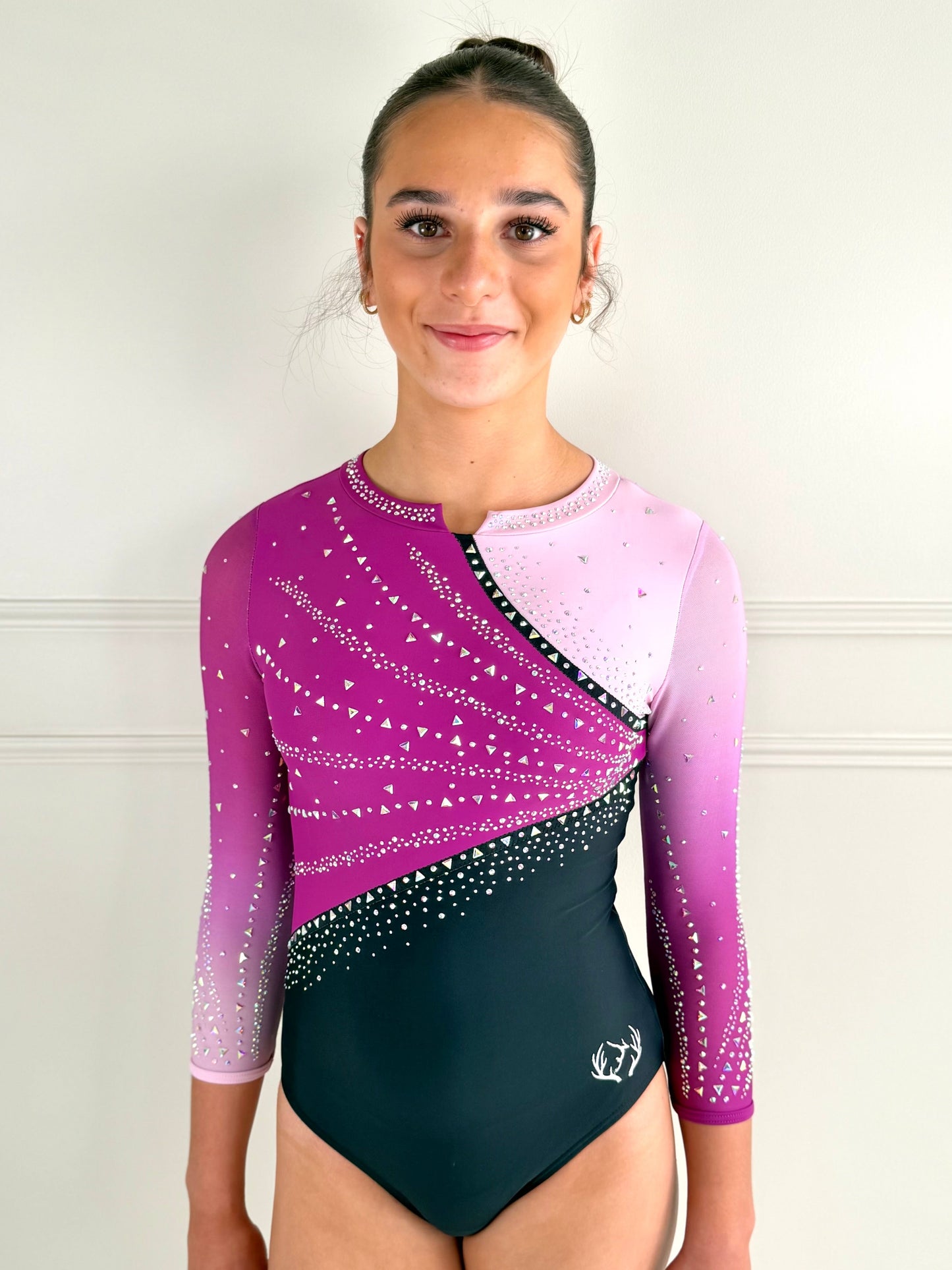 Pink gymnastics competition leotard.