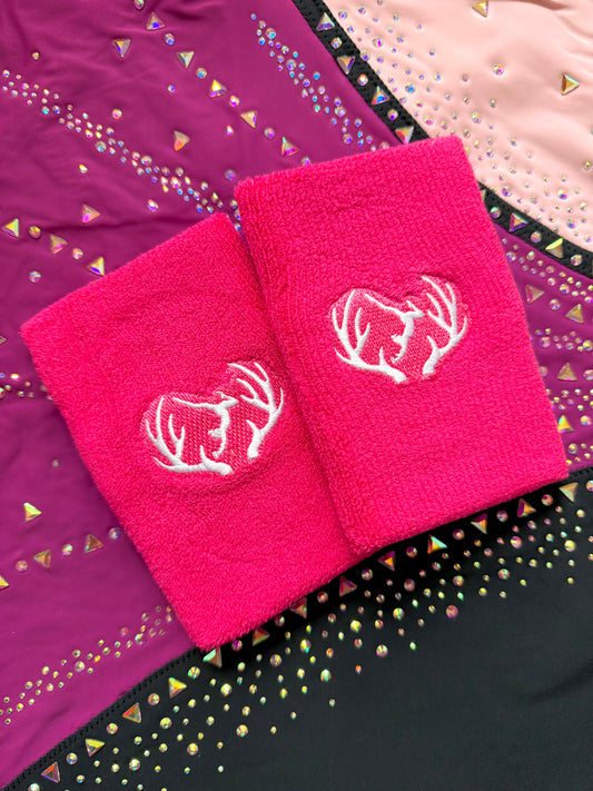 Pink gymnastics wristbands.
