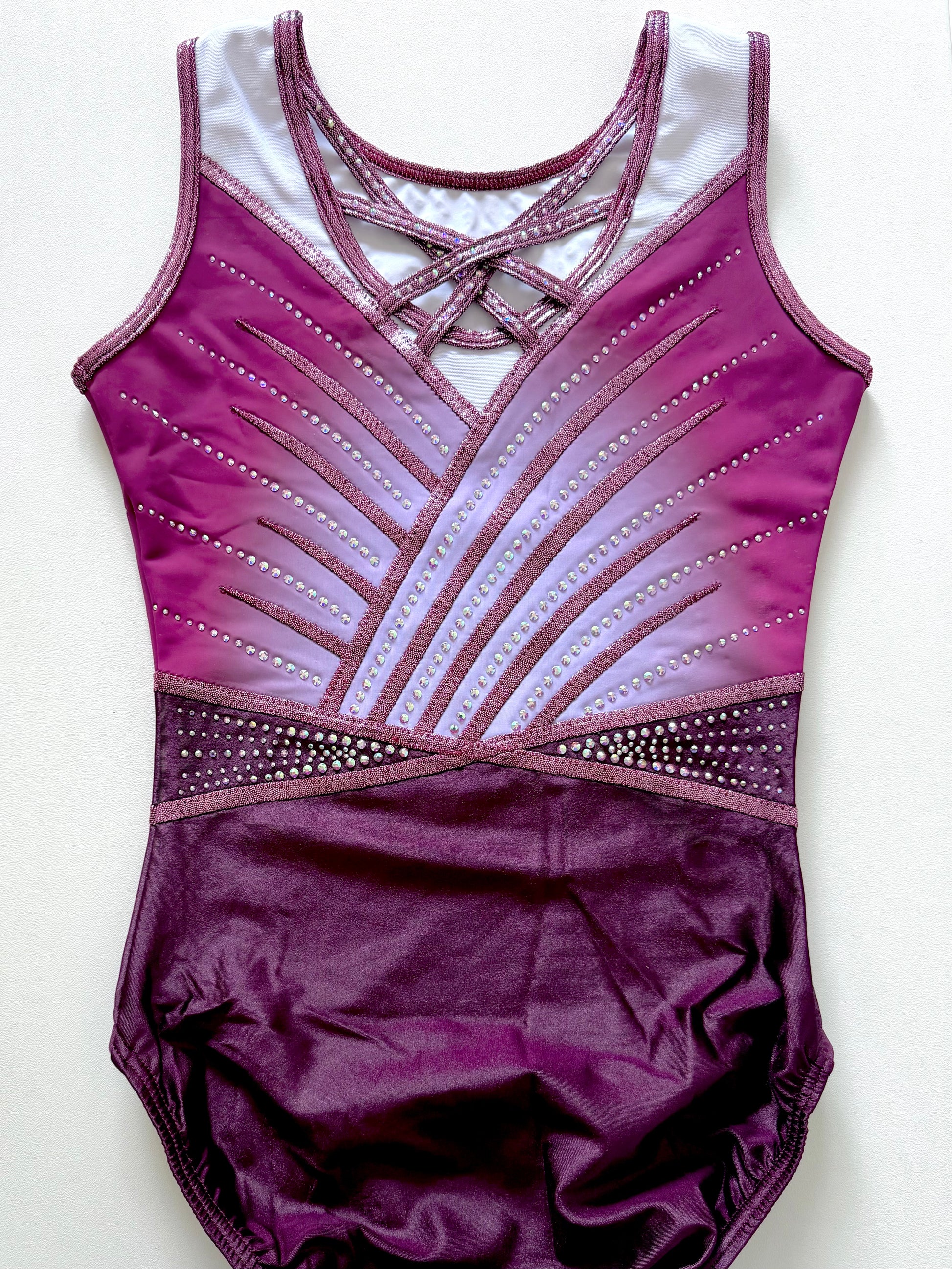 Strappy back pink leotard.