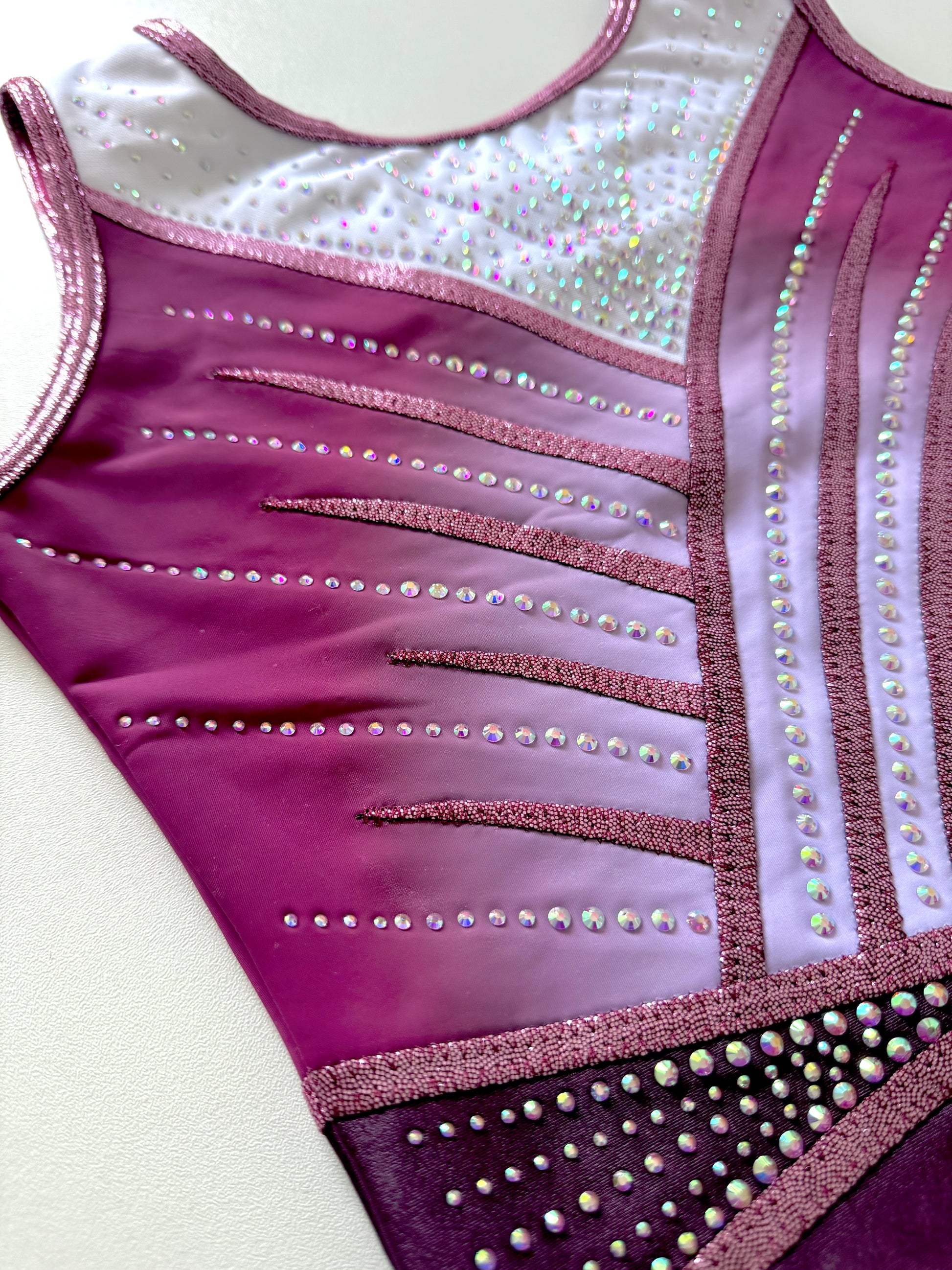 White and pink gymnastics leotard.