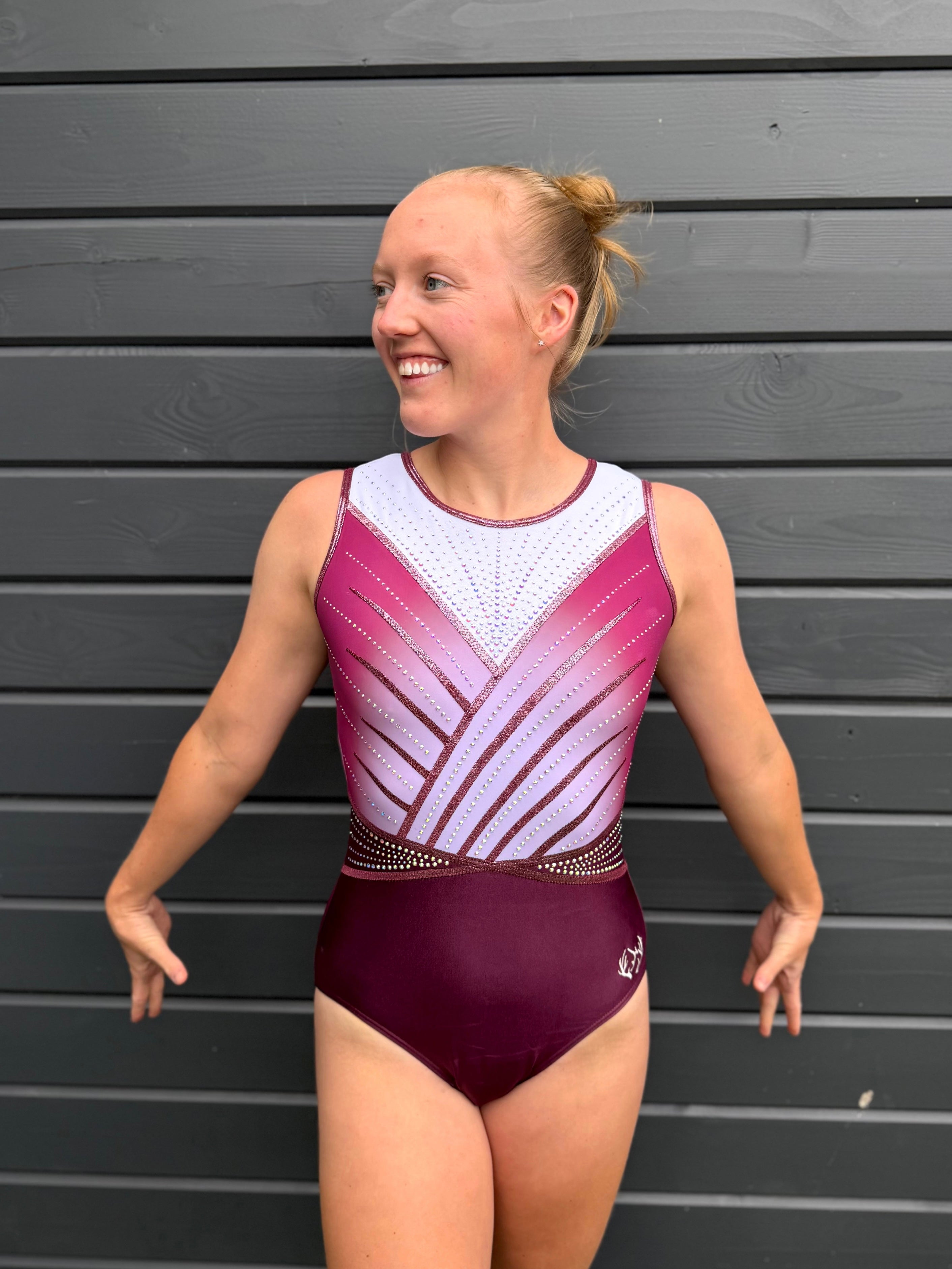 White and pink gymnastics leotard.
