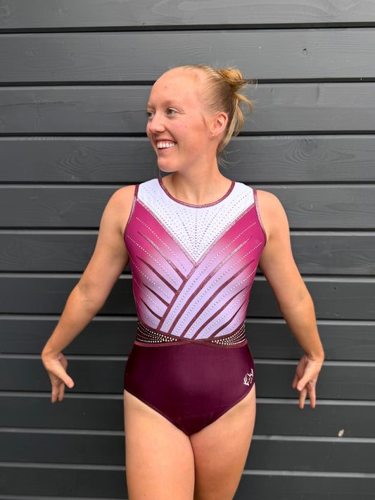 White and pink gymnastics leotard.
