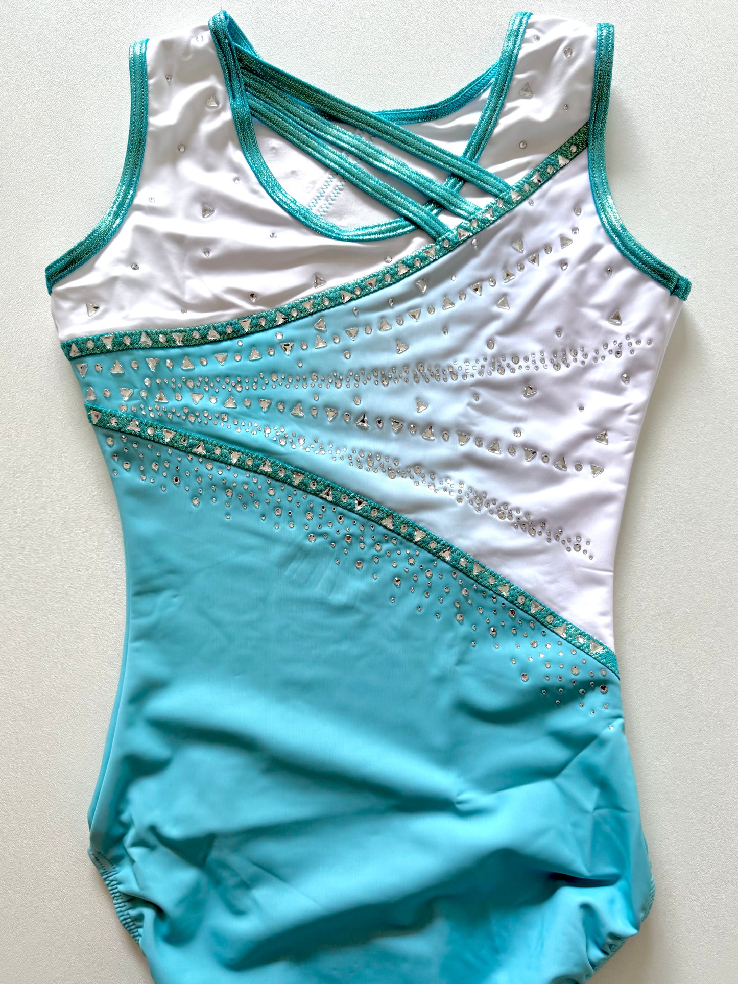 Mint green gymnastics leotard.