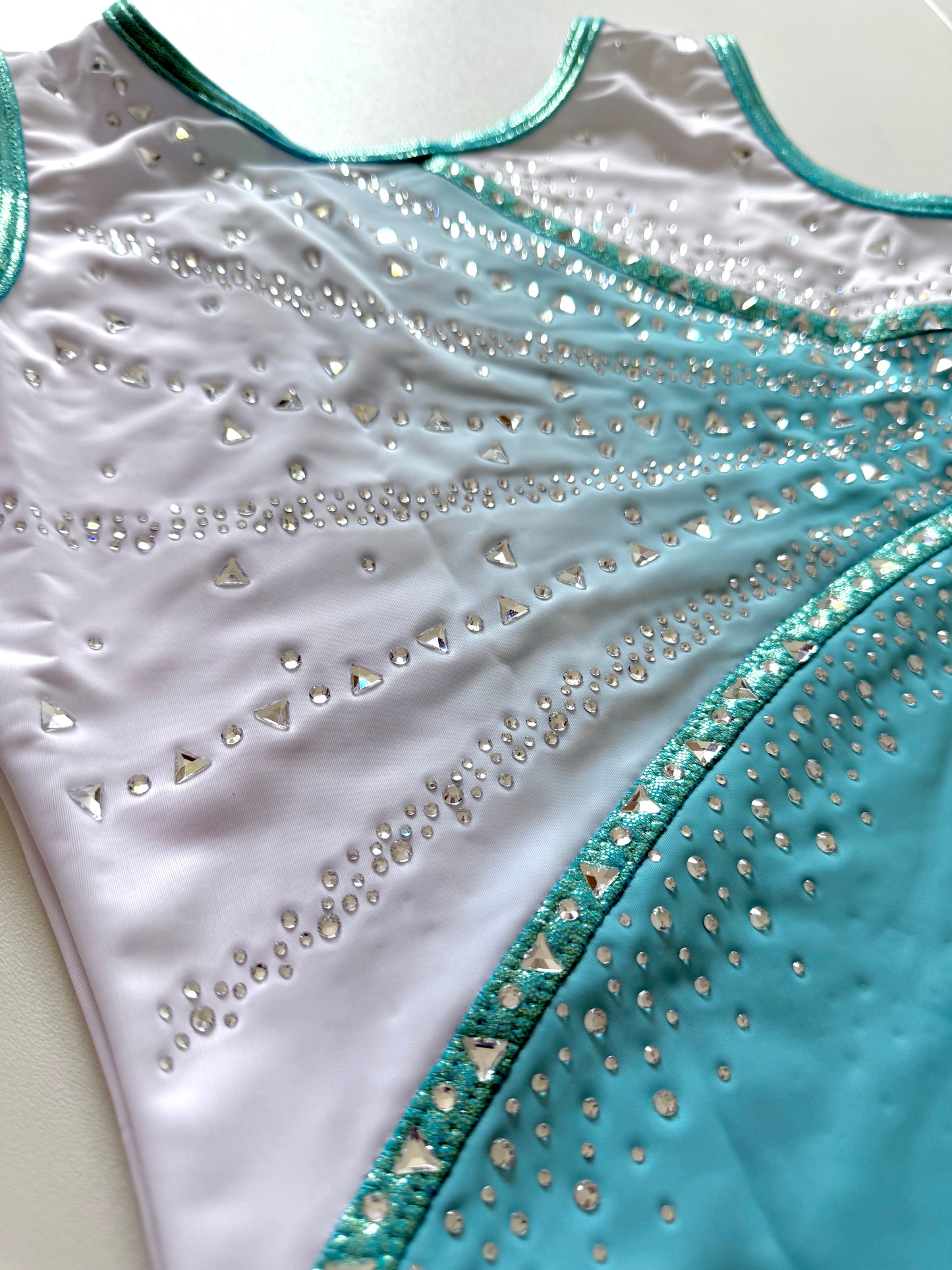 Pastel blue gymnastics leotard.